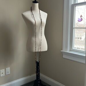 90 inches long. Also known as flapper length tiger eye necklace.